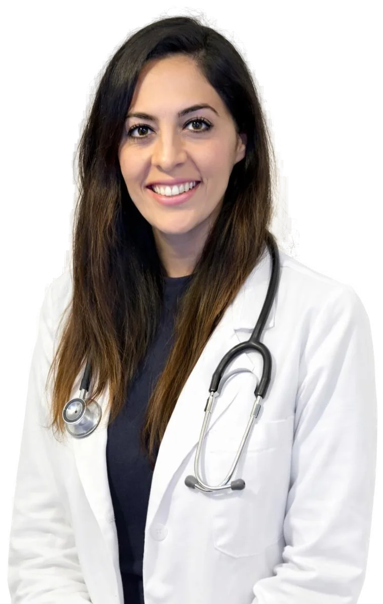 Dr. Shahrzad A. Dilmaghani, DPM, smiling, in a white coat with a stethoscope